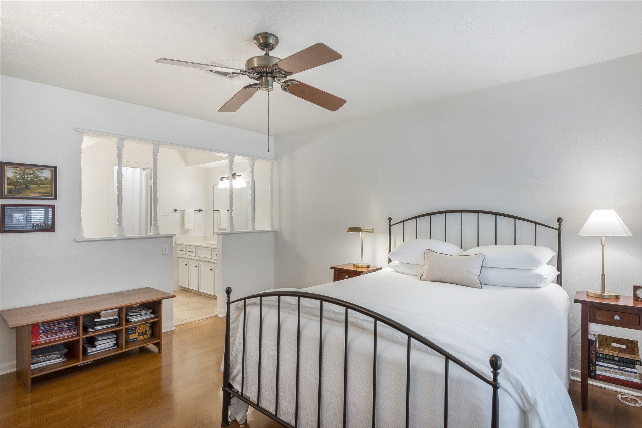 7622 Feliciana Lane Spring, TX 77379 - Photo 19 of 34 a bedroom with a bed and a chandelier