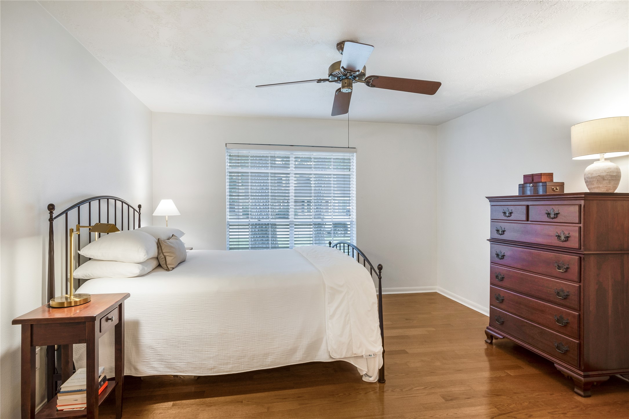 7622 Feliciana Lane Spring, TX 77379 - Photo 20 of 34 a bedroom with a bed and dresser