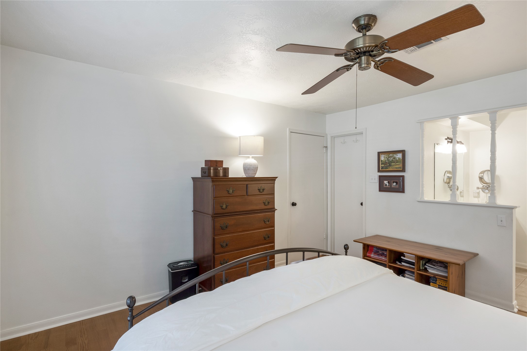 7622 Feliciana Lane Spring, TX 77379 - Photo 21 of 34 a bedroom with a bed and a chandelier