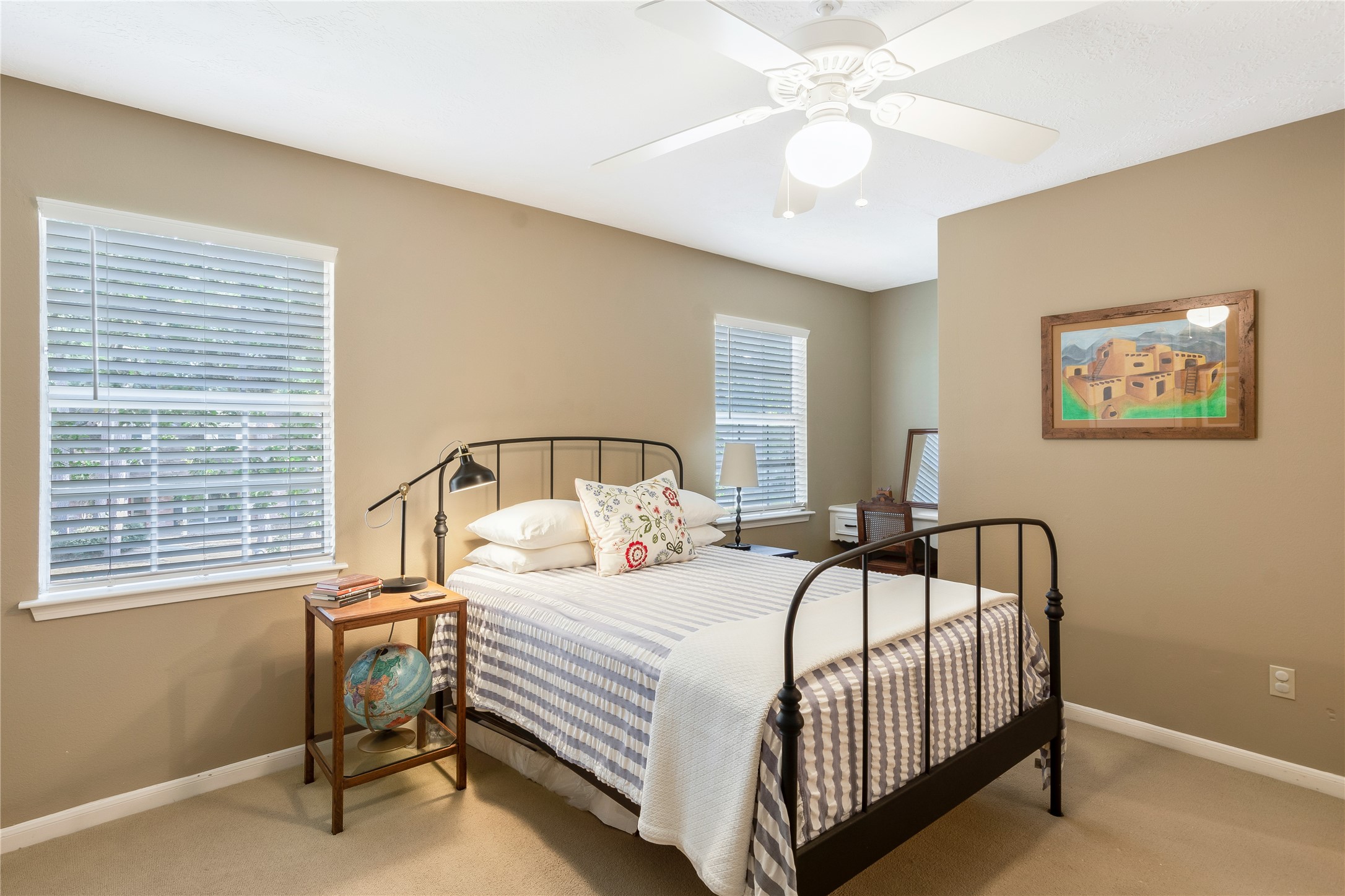 7622 Feliciana Lane Spring, TX 77379 - Photo 25 of 34 a bedroom with a bed and a chandelier