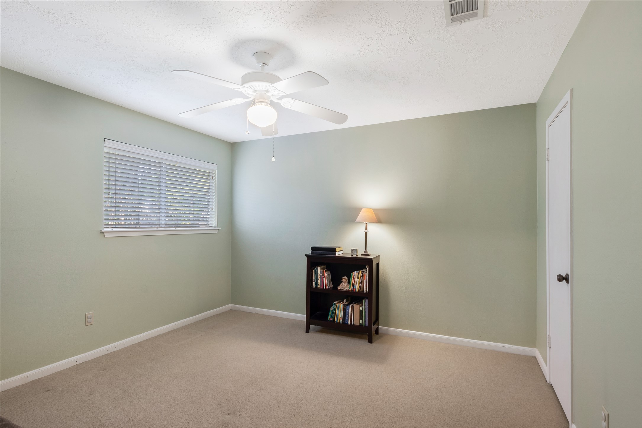 7622 Feliciana Lane Spring, TX 77379 - Photo 26 of 34 an empty room with chandelier fan