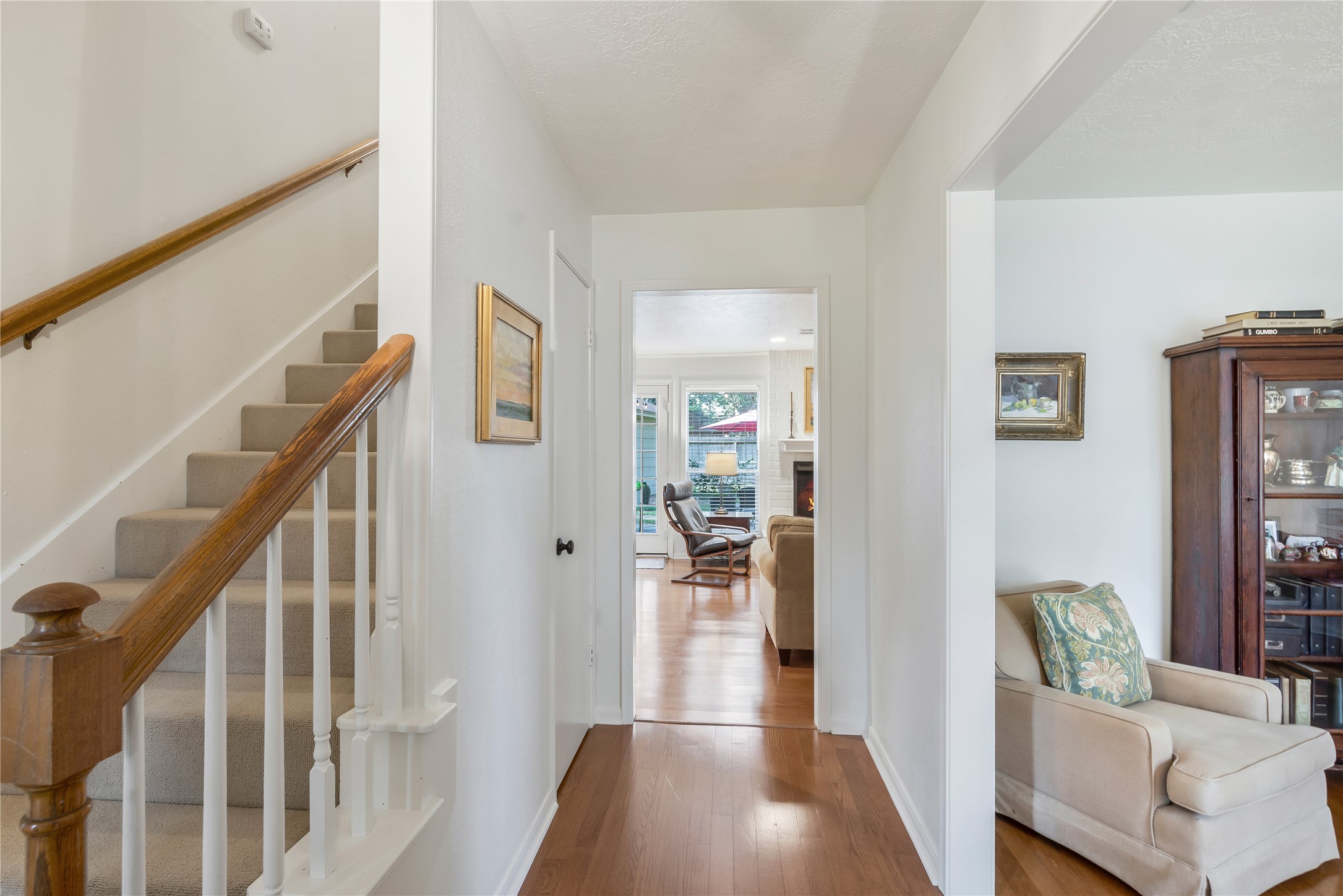 7622 Feliciana Lane Spring, TX 77379 - Photo 3 of 34 a view of a hallway with wooden floor and furniture