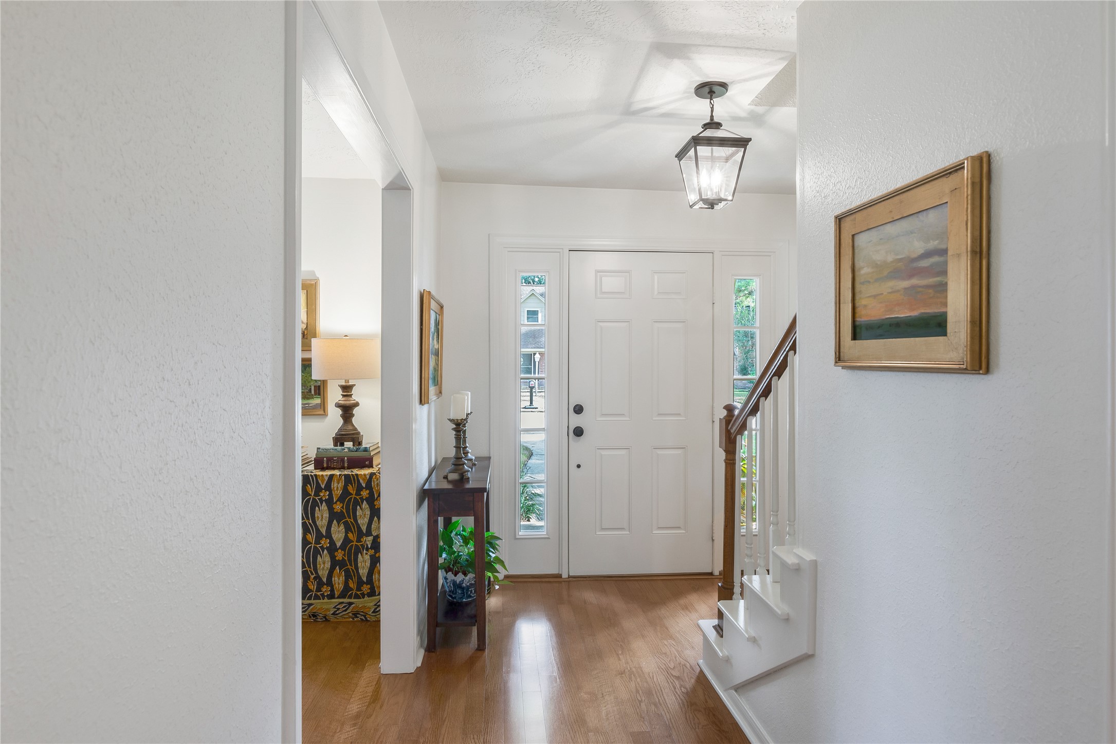 7622 Feliciana Lane Spring, TX 77379 - Photo 8 of 34 a view of a hallway with wooden floor and a dining room