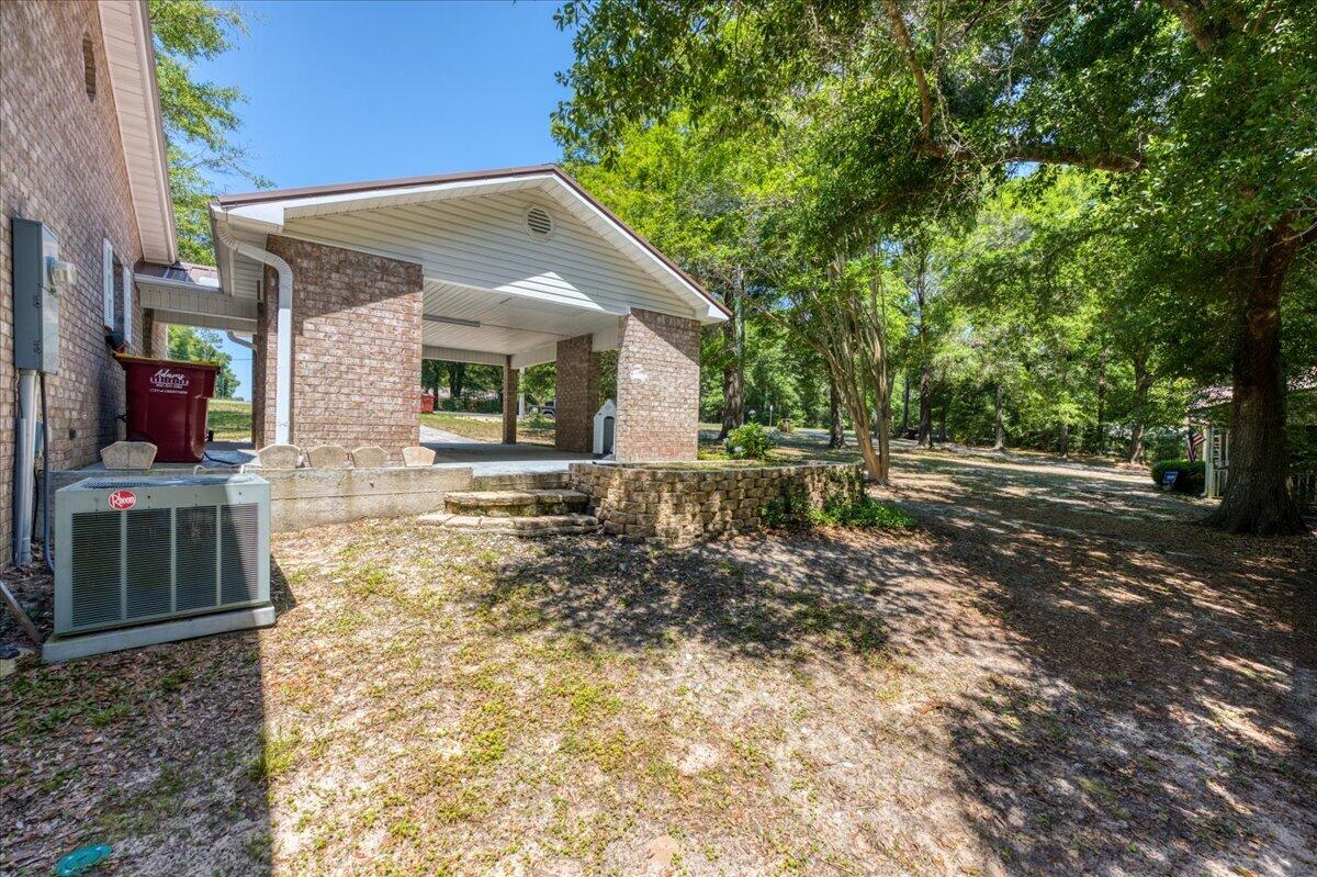 210 Shell Drive Crestview, FL 32536 - Photo 46 of 67 a front view of a house with a yard