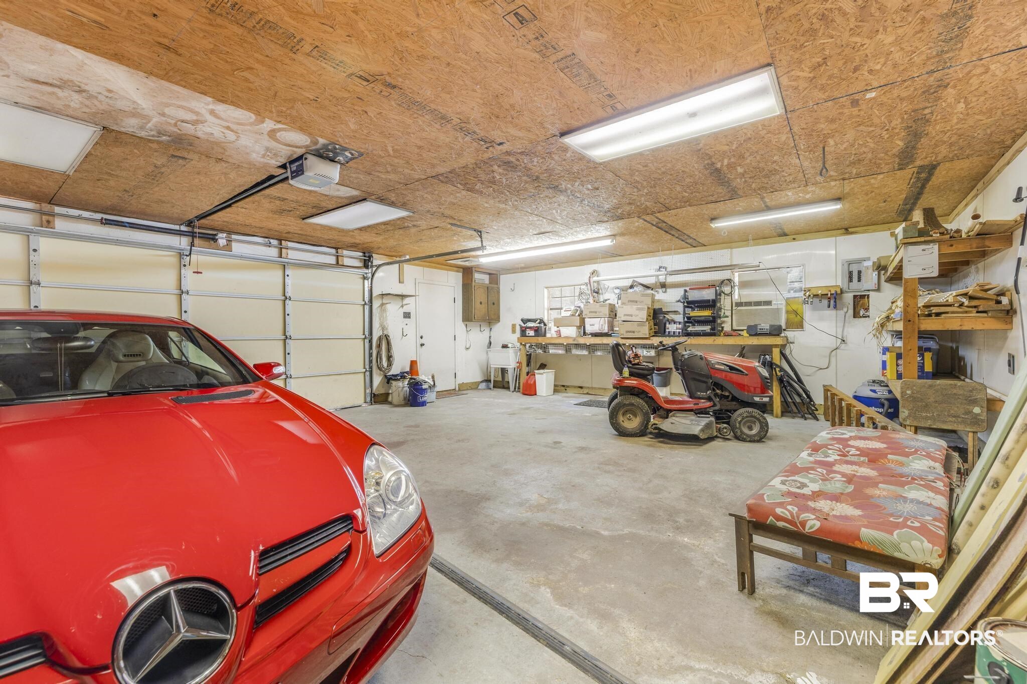 2573 E Road Mobile, AL 36693 - Photo 26 of 45 Garage with a garage door opener and a workshop area