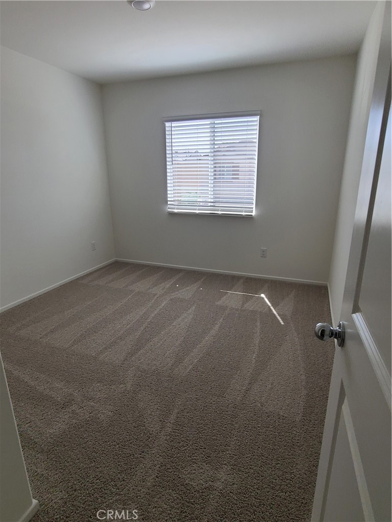30540 Altima Court Winchester, CA 92596 - Photo 14 of 21 an empty room with a window