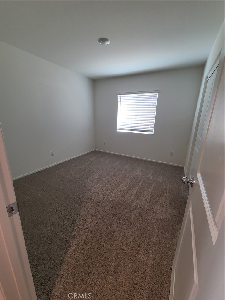30540 Altima Court Winchester, CA 92596 - Photo 16 of 21 an empty room with windows