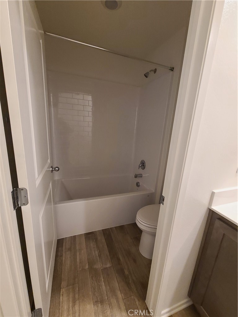 30540 Altima Court Winchester, CA 92596 - Photo 20 of 21 a bathroom with a sink a toilet a tub and shower