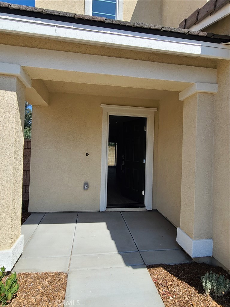 30540 Altima Court Winchester, CA 92596 - Photo 3 of 21 a view of a car garage door