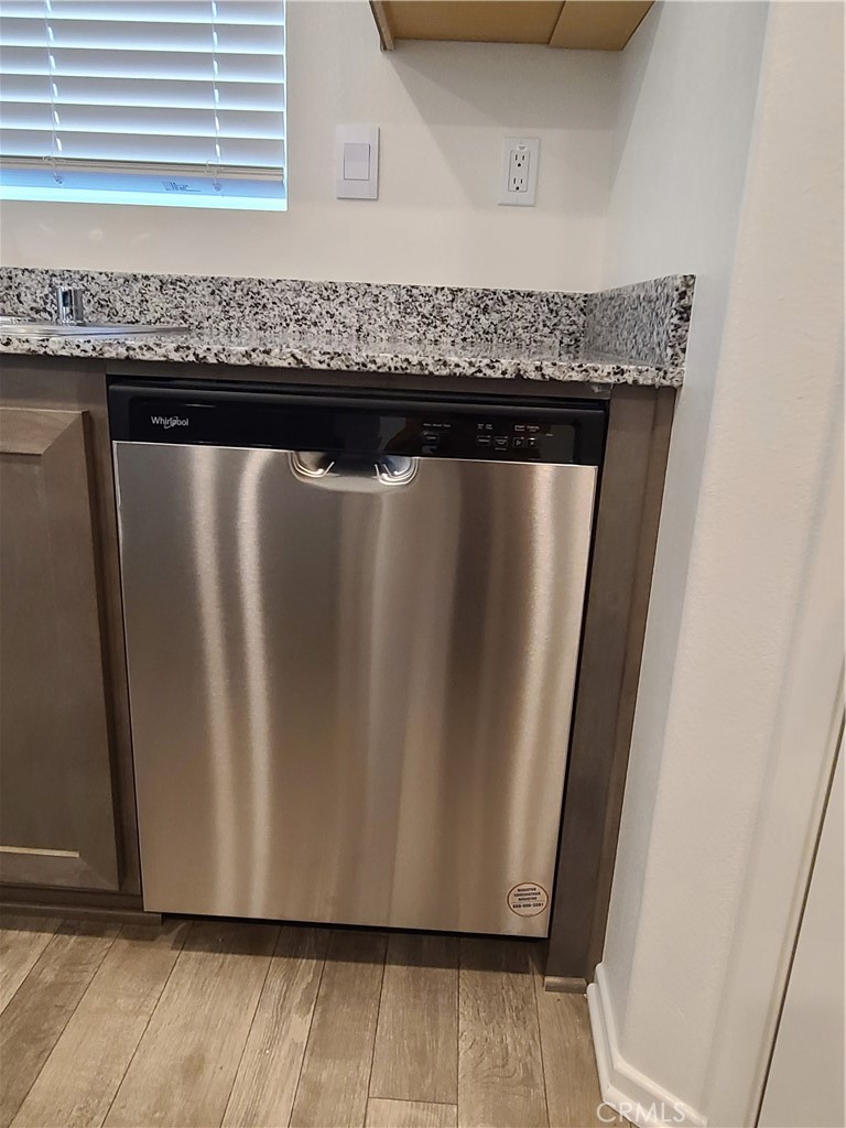 30540 Altima Court Winchester, CA 92596 - Photo 7 of 21 a close view of kitchen countertops with wooden floor