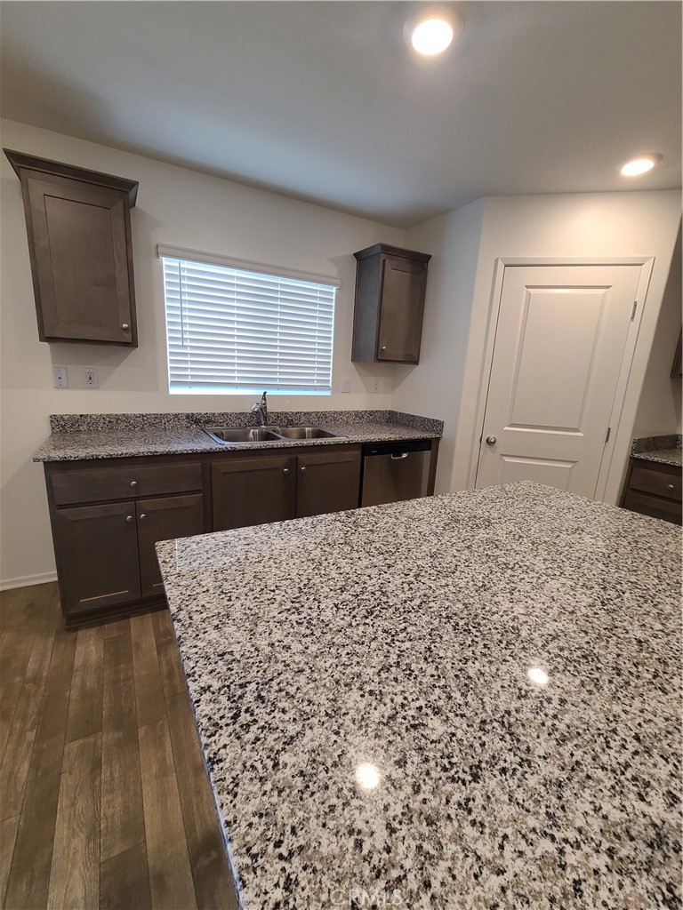 30540 Altima Court Winchester, CA 92596 - Photo 8 of 21 a kitchen with kitchen island sink and refrigerator