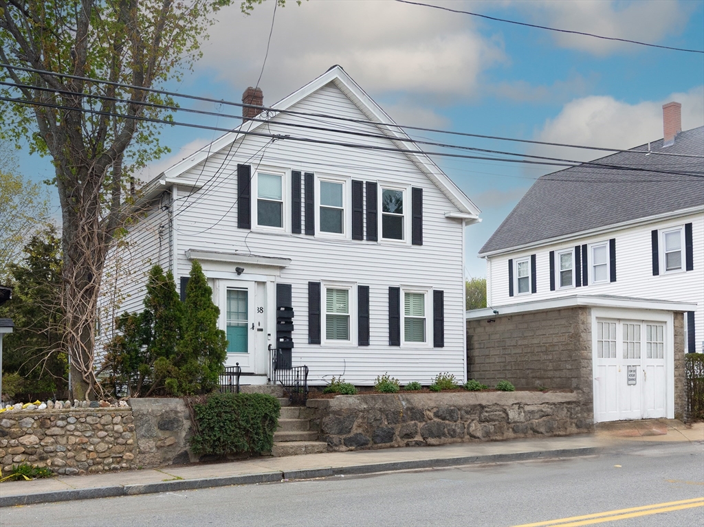 38 Depot Street Milford, MA 01757 - Photo 1 of 34 a front view of a house with a yard
