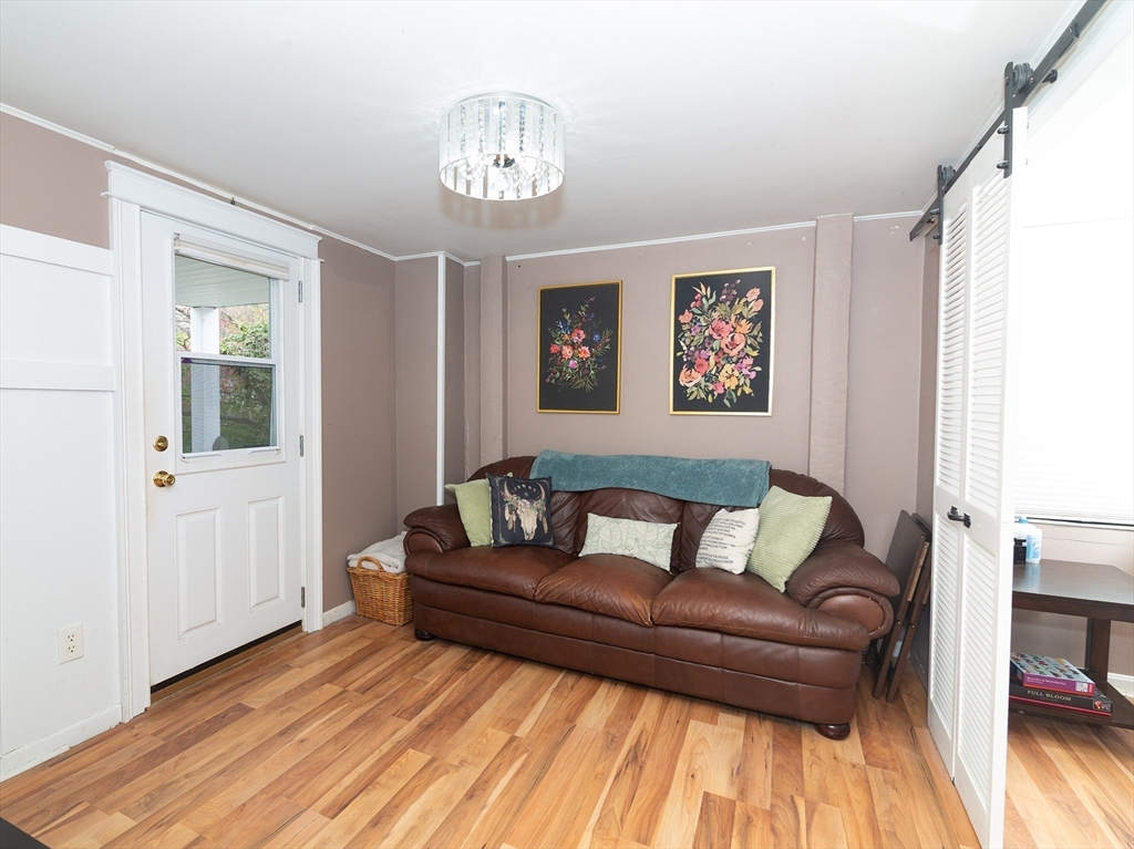 38 Depot Street Milford, MA 01757 - Photo 11 of 34 a living room with furniture and a wooden floor