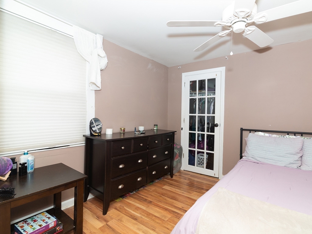 38 Depot Street Milford, MA 01757 - Photo 13 of 34 a bedroom with a bed and a table