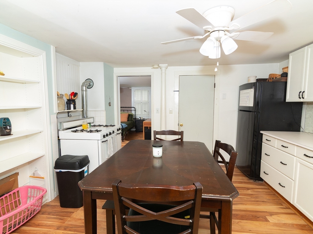 38 Depot Street Milford, MA 01757 - Photo 16 of 34 a view of a dining room with furniture and wooden floor