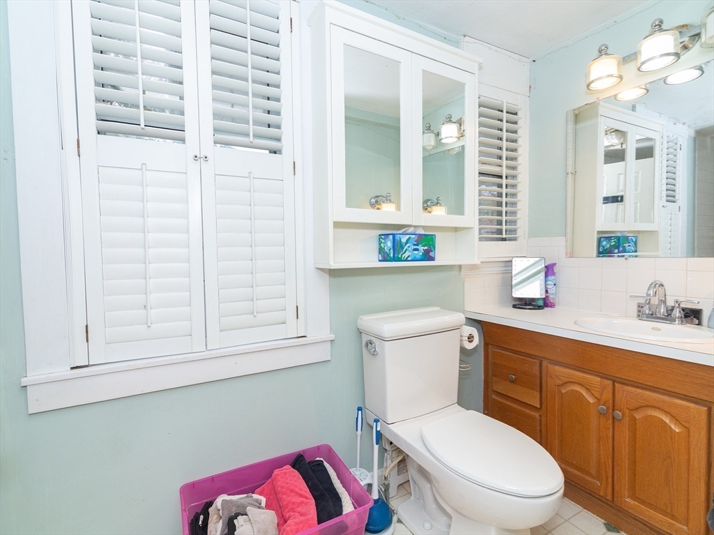 38 Depot Street Milford, MA 01757 - Photo 19 of 34 a bathroom with a toilet a sink and a mirror