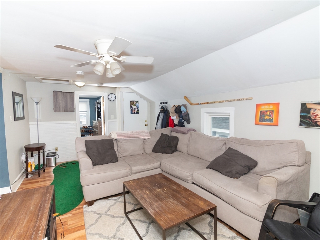 38 Depot Street Milford, MA 01757 - Photo 21 of 34 a living room with furniture and a chandelier