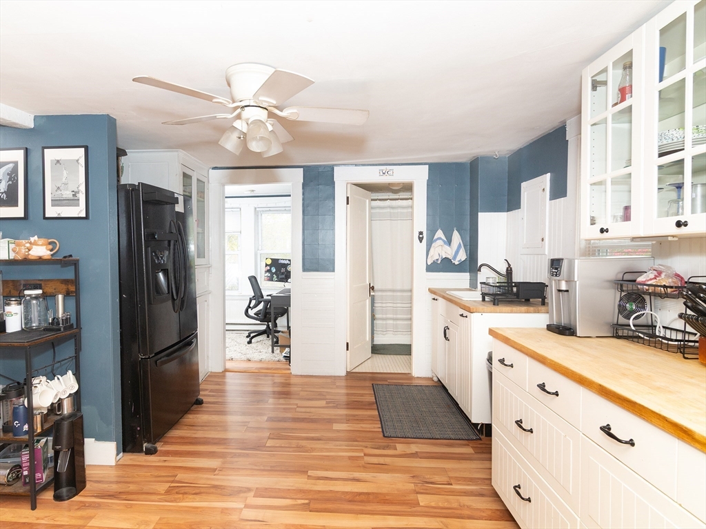 38 Depot Street Milford, MA 01757 - Photo 32 of 34 a kitchen with stainless steel appliances granite countertop a refrigerator and microwave