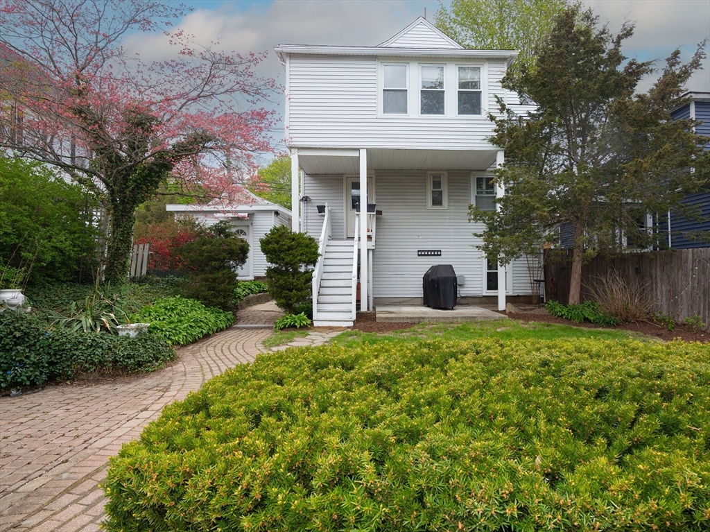 38 Depot Street Milford, MA 01757 - Photo 34 of 34 a view of a white house with a yard and large tree