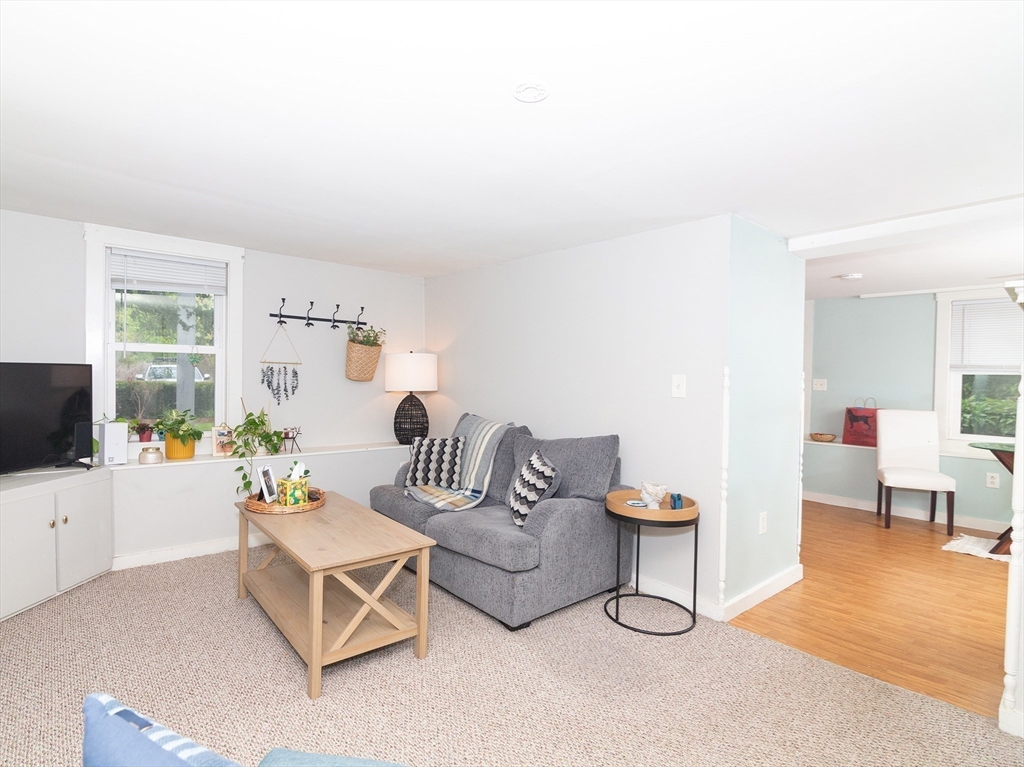 38 Depot Street Milford, MA 01757 - Photo 6 of 34 a living room with furniture and a flat screen tv
