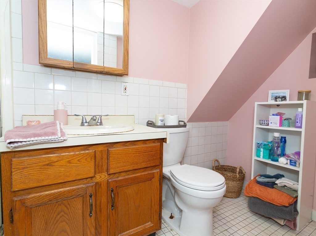 38 Depot Street Milford, MA 01757 - Photo 10 of 34 a bathroom with a toilet a sink and a shower