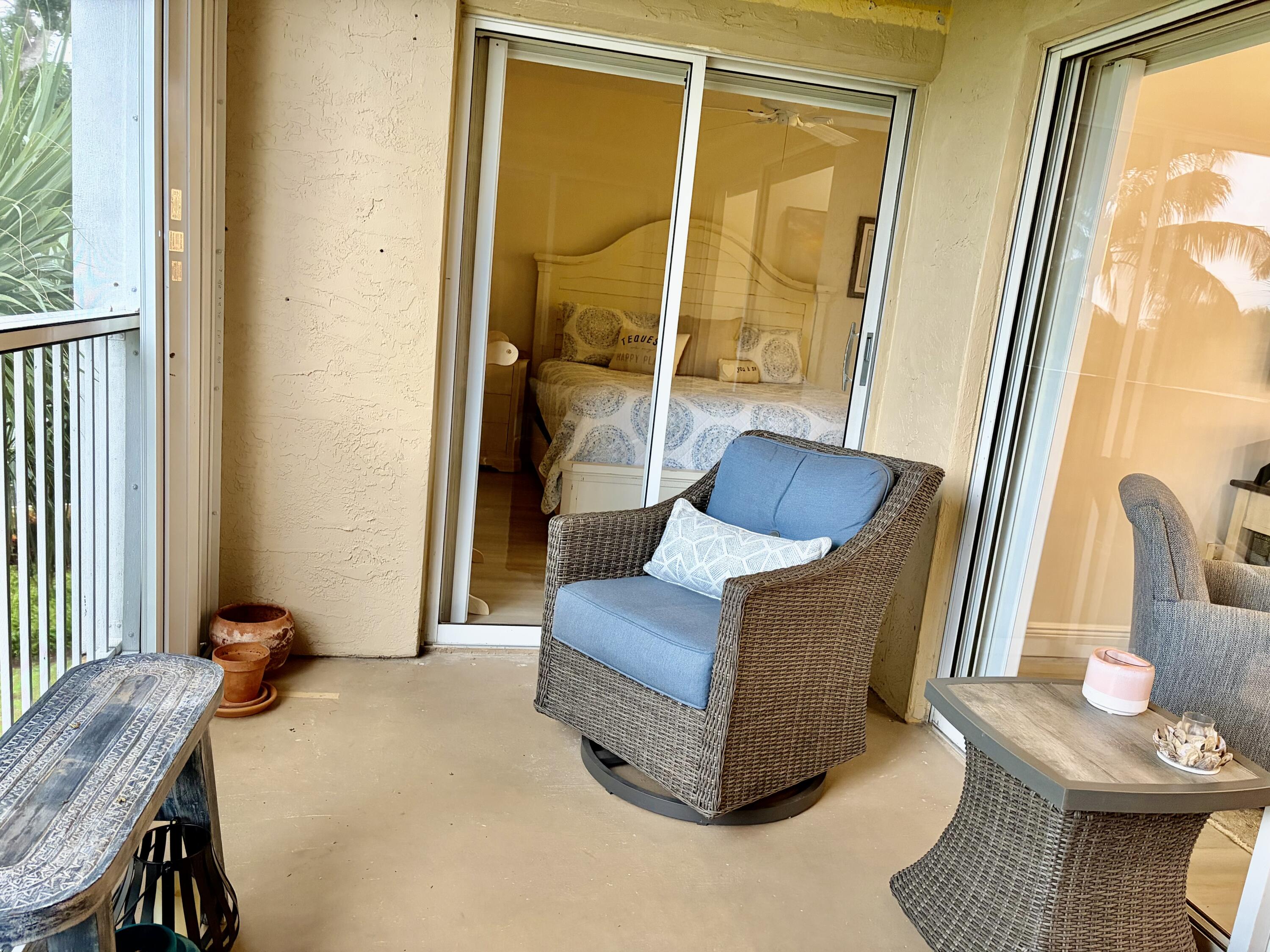 242 Village Boulevard, Unit 2304 Tequesta, FL 33469 - Photo 15 of 34 a living room with furniture and a window