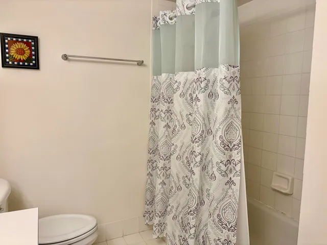 a bathroom with a toilet and shower
