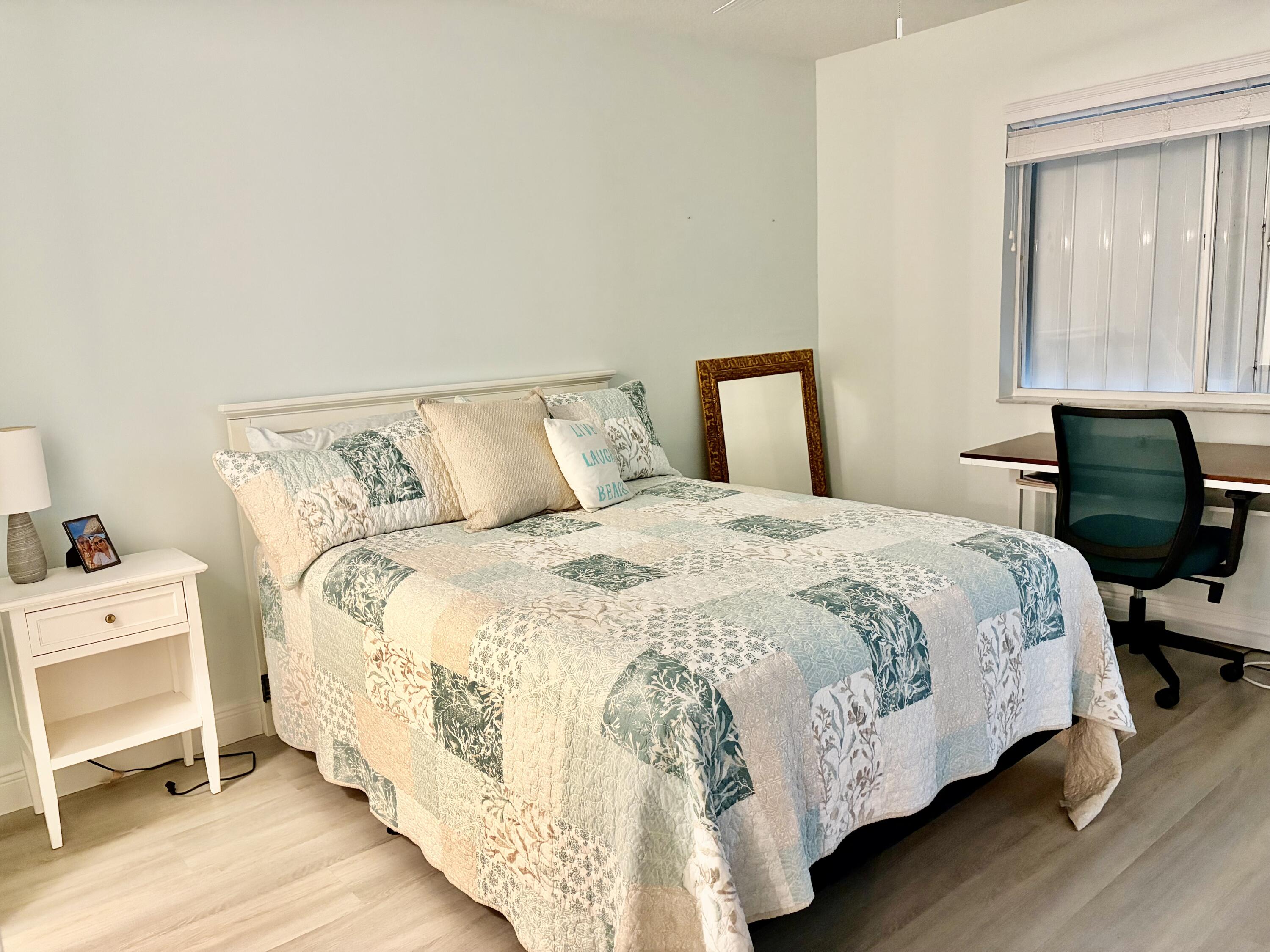 242 Village Boulevard, Unit 2304 Tequesta, FL 33469 - Photo 25 of 34 a bedroom with a bed and a window