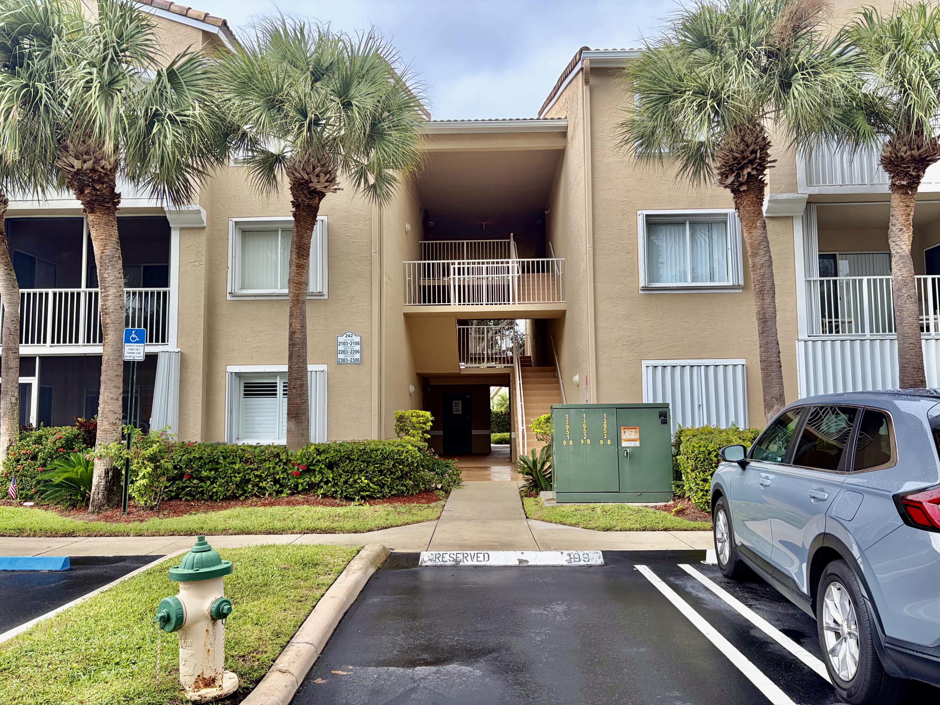 242 Village Boulevard, Unit 2304 Tequesta, FL 33469 - Photo 29 of 34 a house view with a garden space