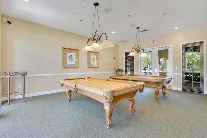 242 Village Boulevard, Unit 2304 Tequesta, FL 33469 - Photo 33 of 34 a room with pool table and windows