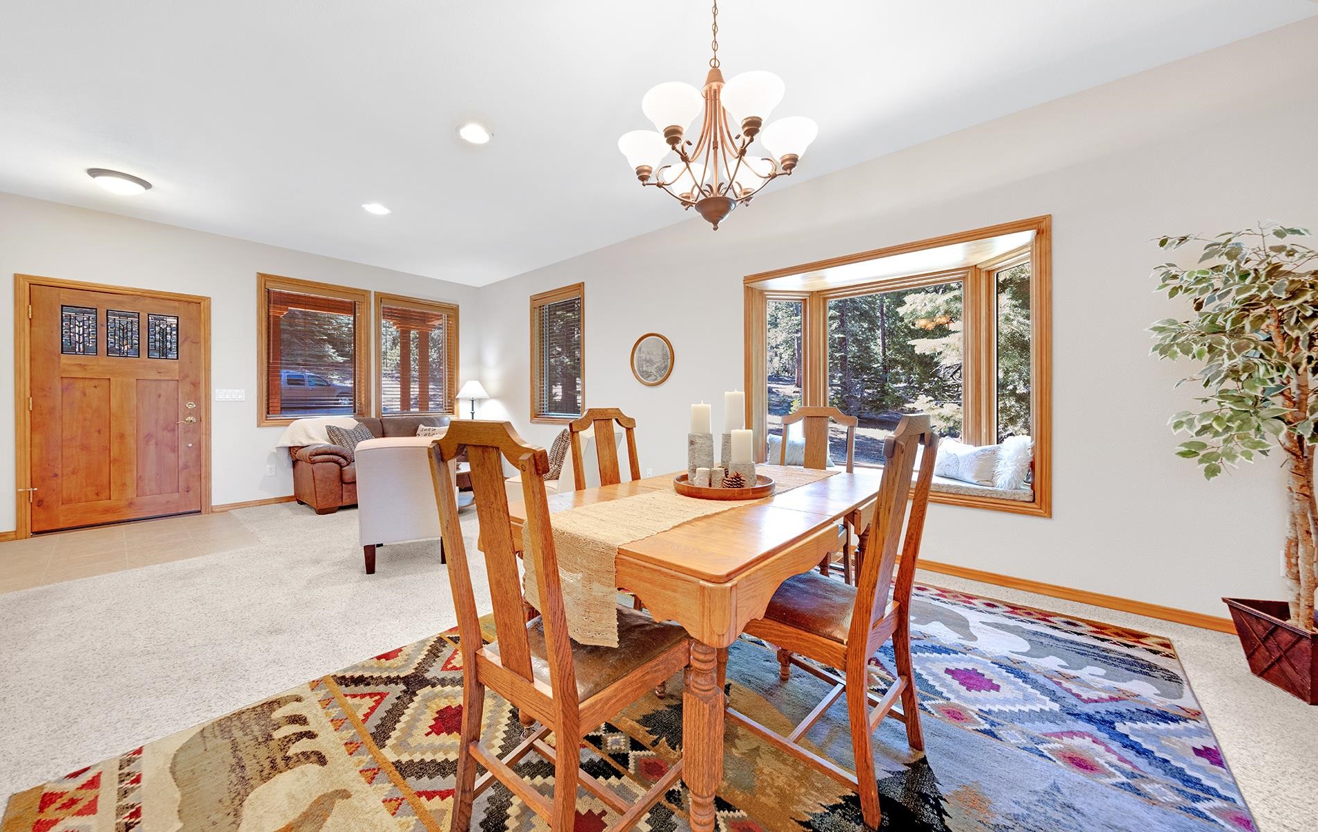 627 Deep Forest Road Lake Almanor, CA 96137 - Photo 4 of 29 a view of a dining room with furniture window and wooden floor
