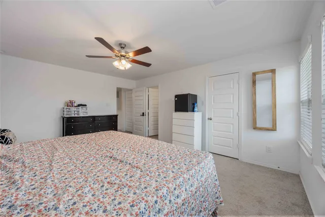 a bed room with a bed and a television