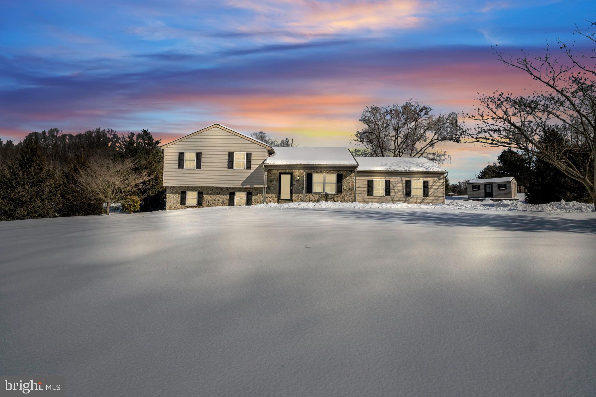 Charming home under a vibrant winter sky.