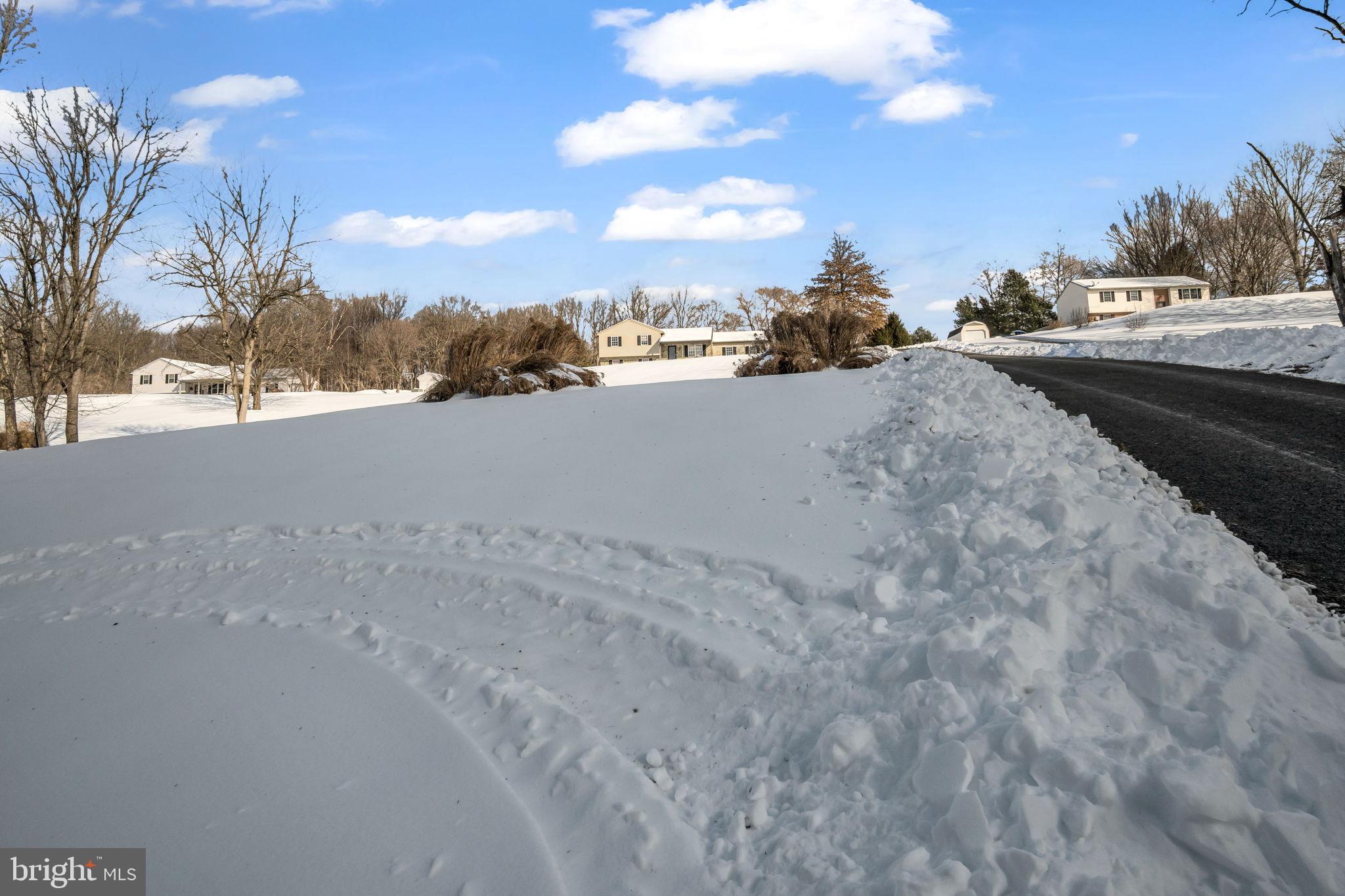169 Covered Bridge Road Elizabethtown, PA 17022 - Photo 30 of 33 Serene winter landscape with snowy road.