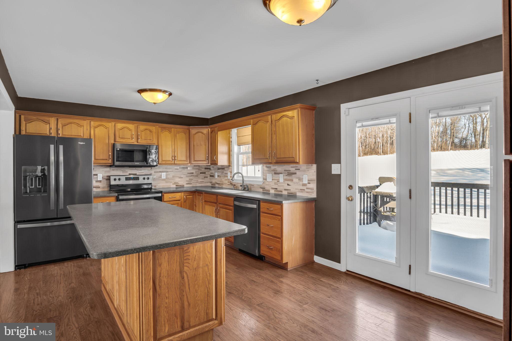 169 Covered Bridge Road Elizabethtown, PA 17022 - Photo 7 of 33 Modern kitchen with warm wood accents.