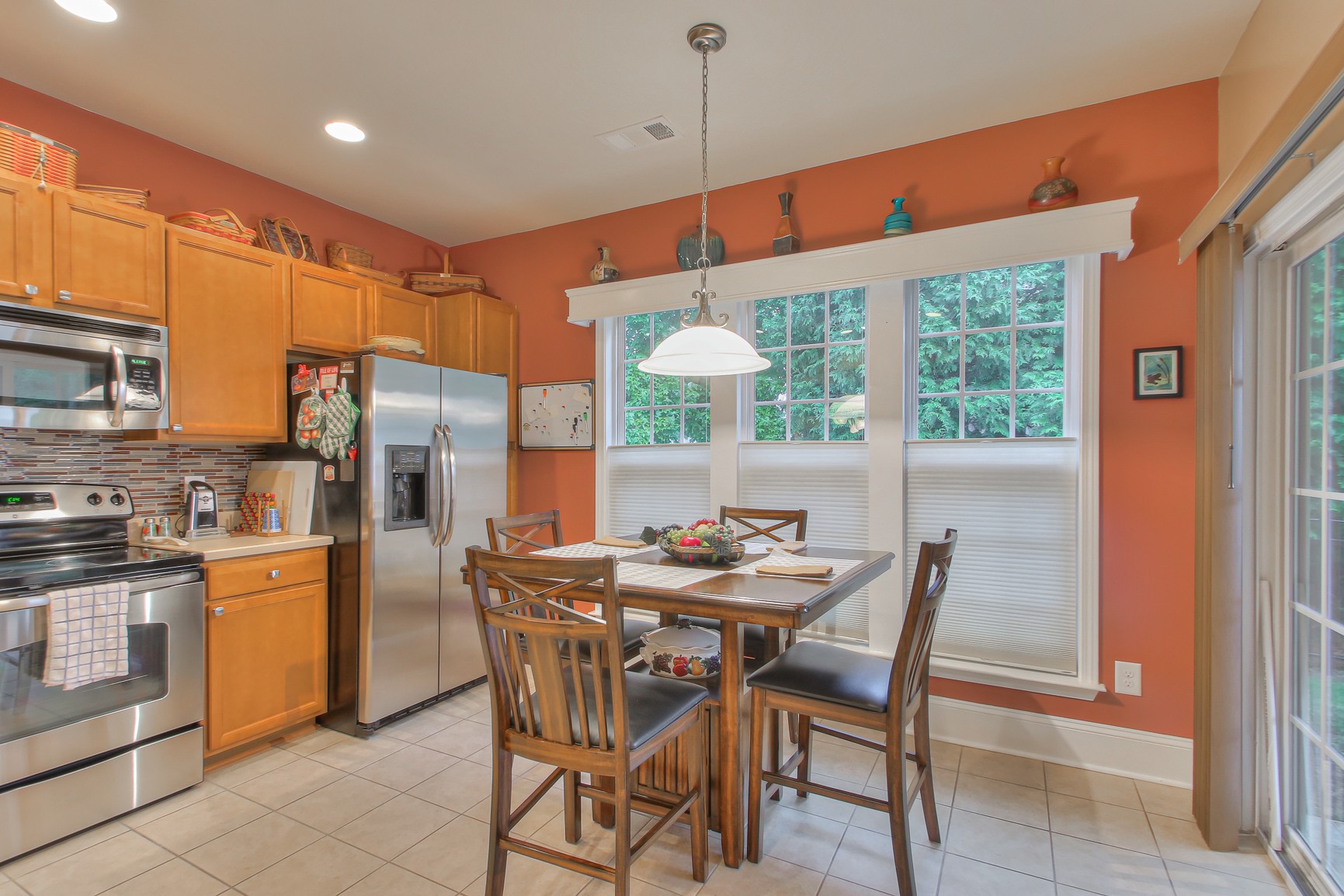 396 Blockade Lane Mount Juliet, TN 37122 - Photo 13 of 30 a dining hall with stainless steel appliances a dining table and chairs