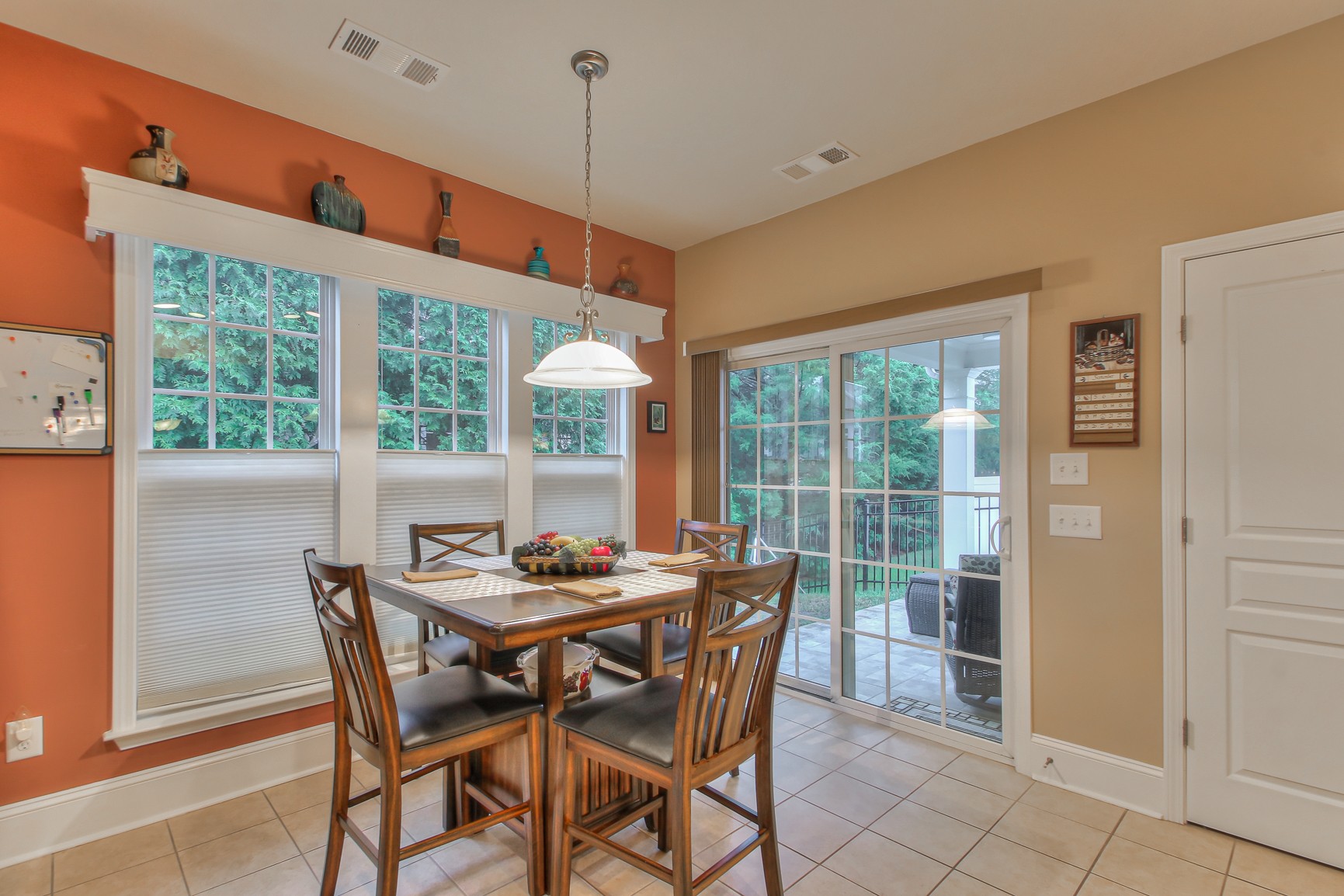 396 Blockade Lane Mount Juliet, TN 37122 - Photo 14 of 30 a dining room with furniture large windows and a chandelier