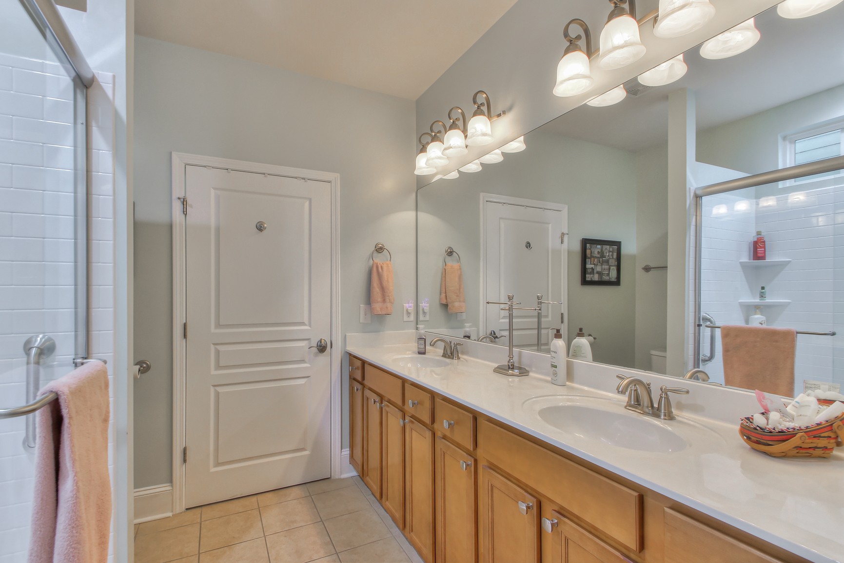 396 Blockade Lane Mount Juliet, TN 37122 - Photo 17 of 30 a spacious bathroom with a granite countertop sink a light fixture and a mirror
