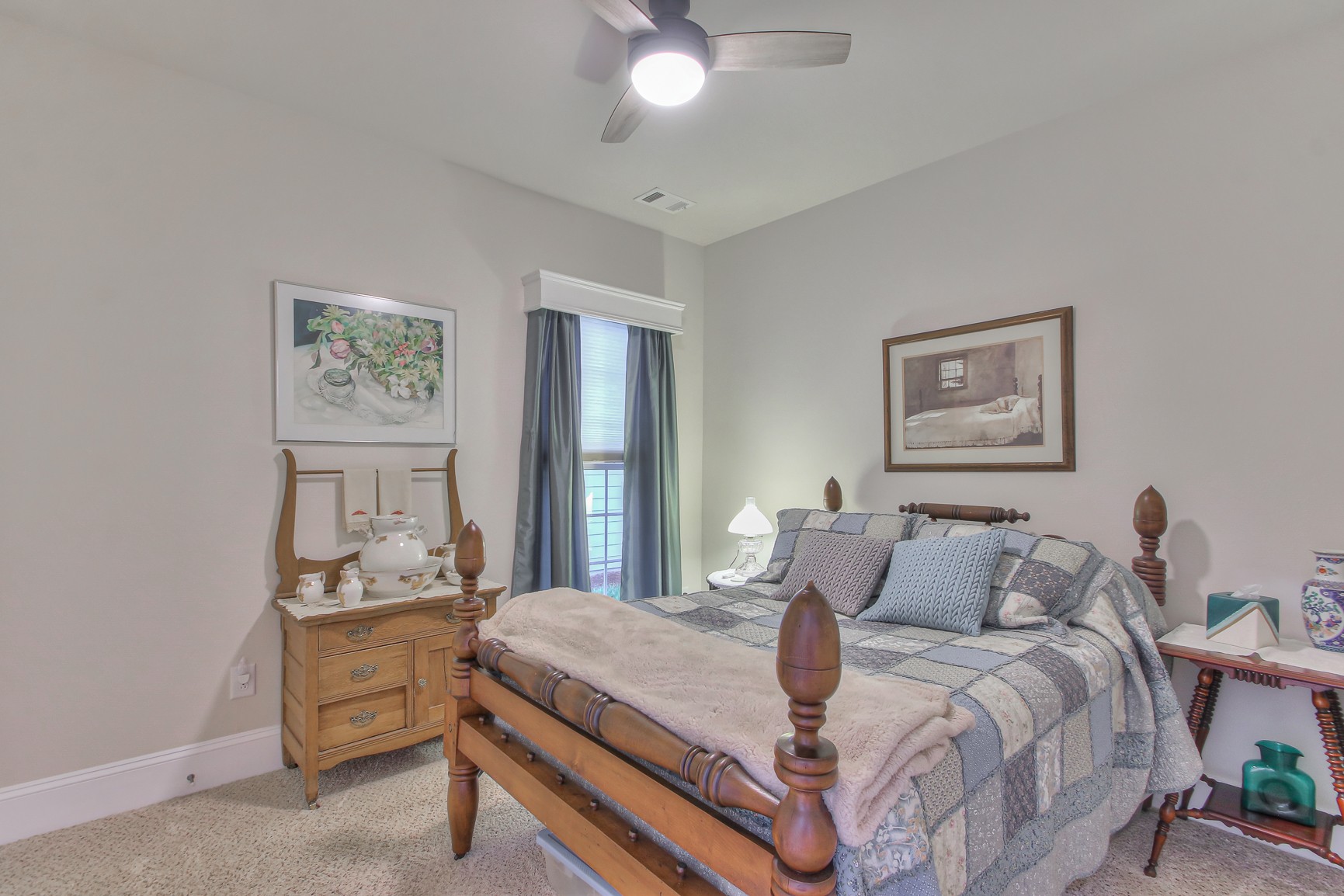 396 Blockade Lane Mount Juliet, TN 37122 - Photo 19 of 30 a bedroom with a bed and a chandelier