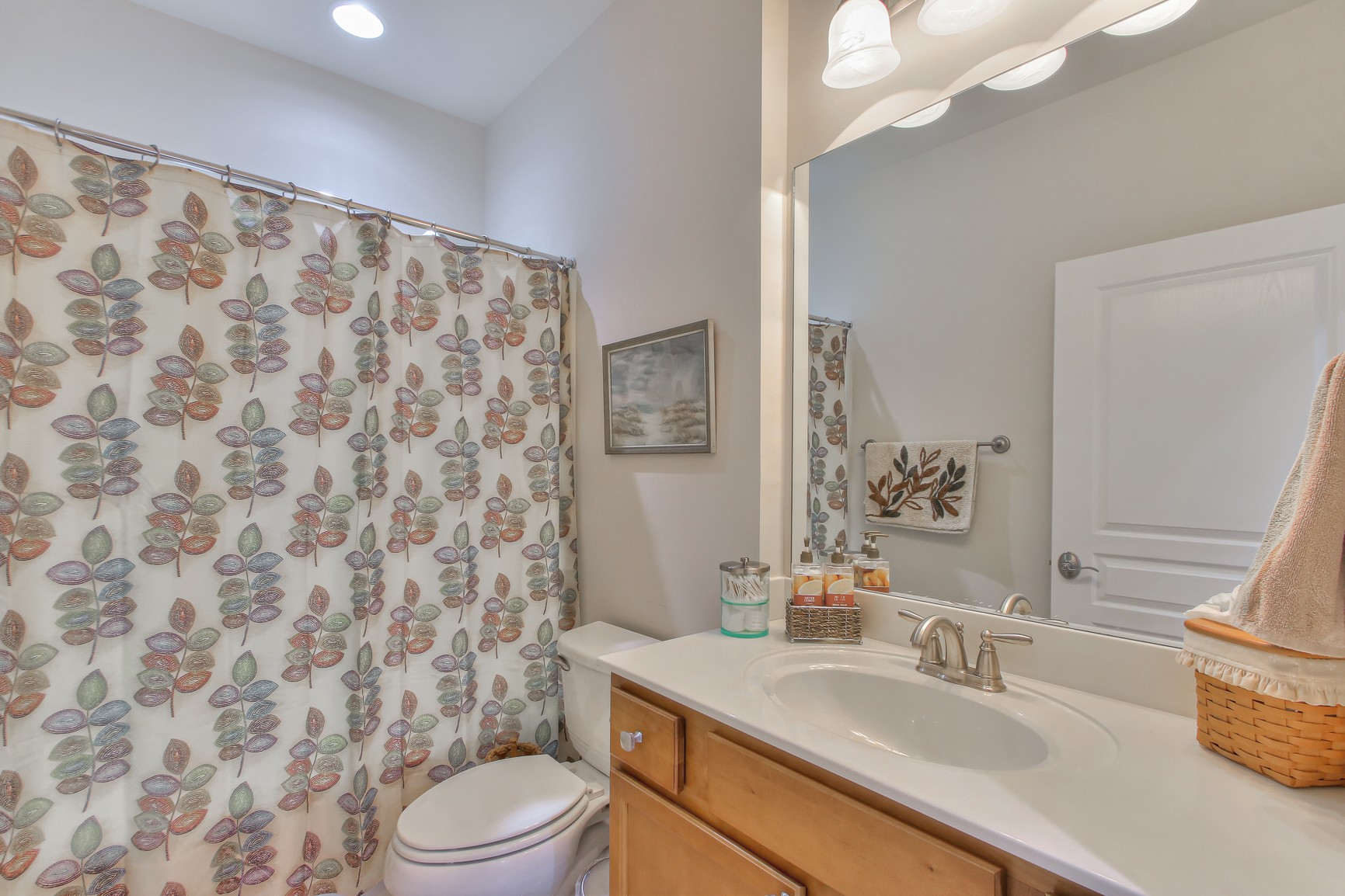 396 Blockade Lane Mount Juliet, TN 37122 - Photo 20 of 30 a bathroom with a sink a toilet and shower curtain