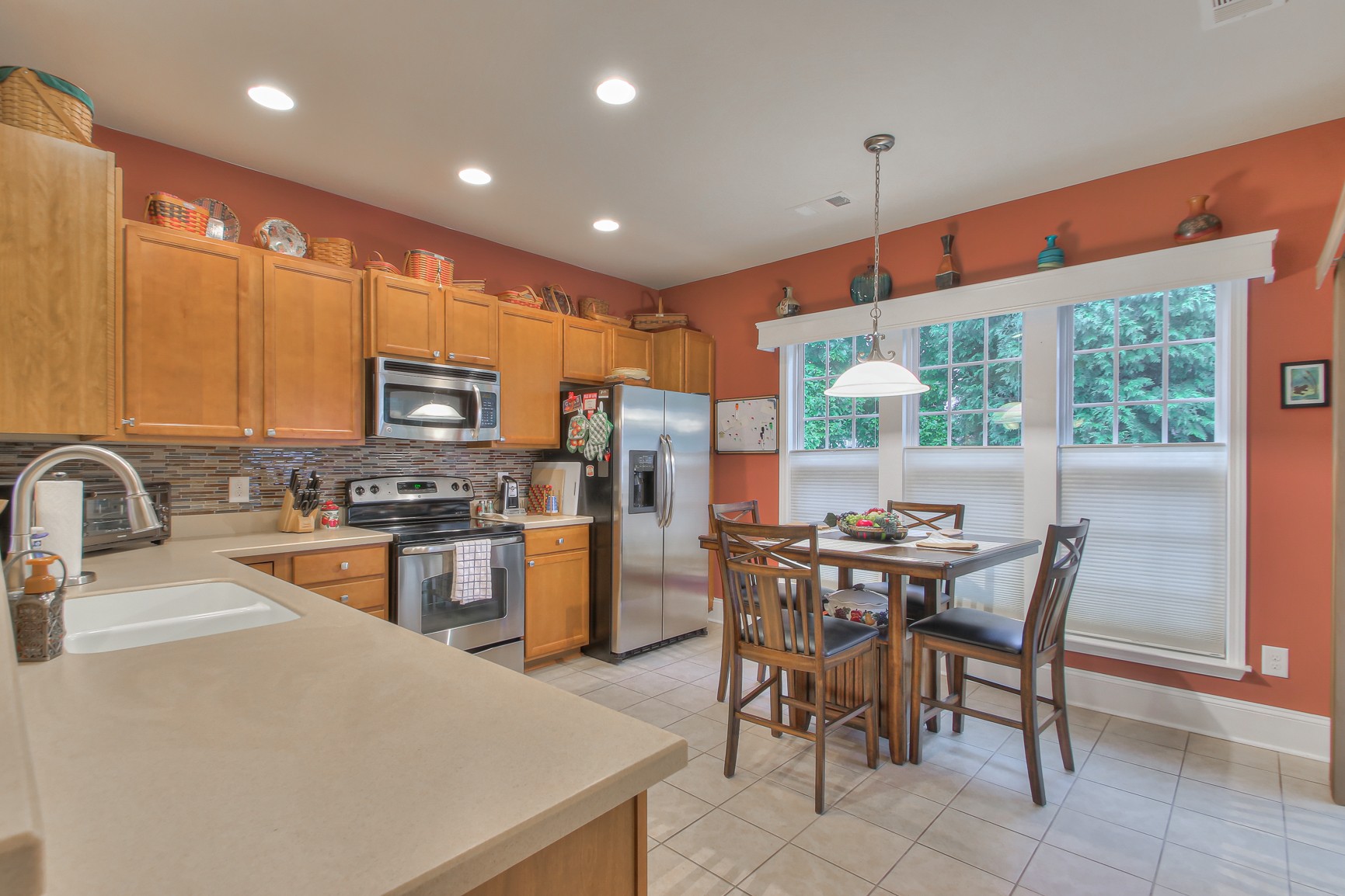 396 Blockade Lane Mount Juliet, TN 37122 - Photo 10 of 30 a kitchen with stainless steel appliances granite countertop sink microwave and stove