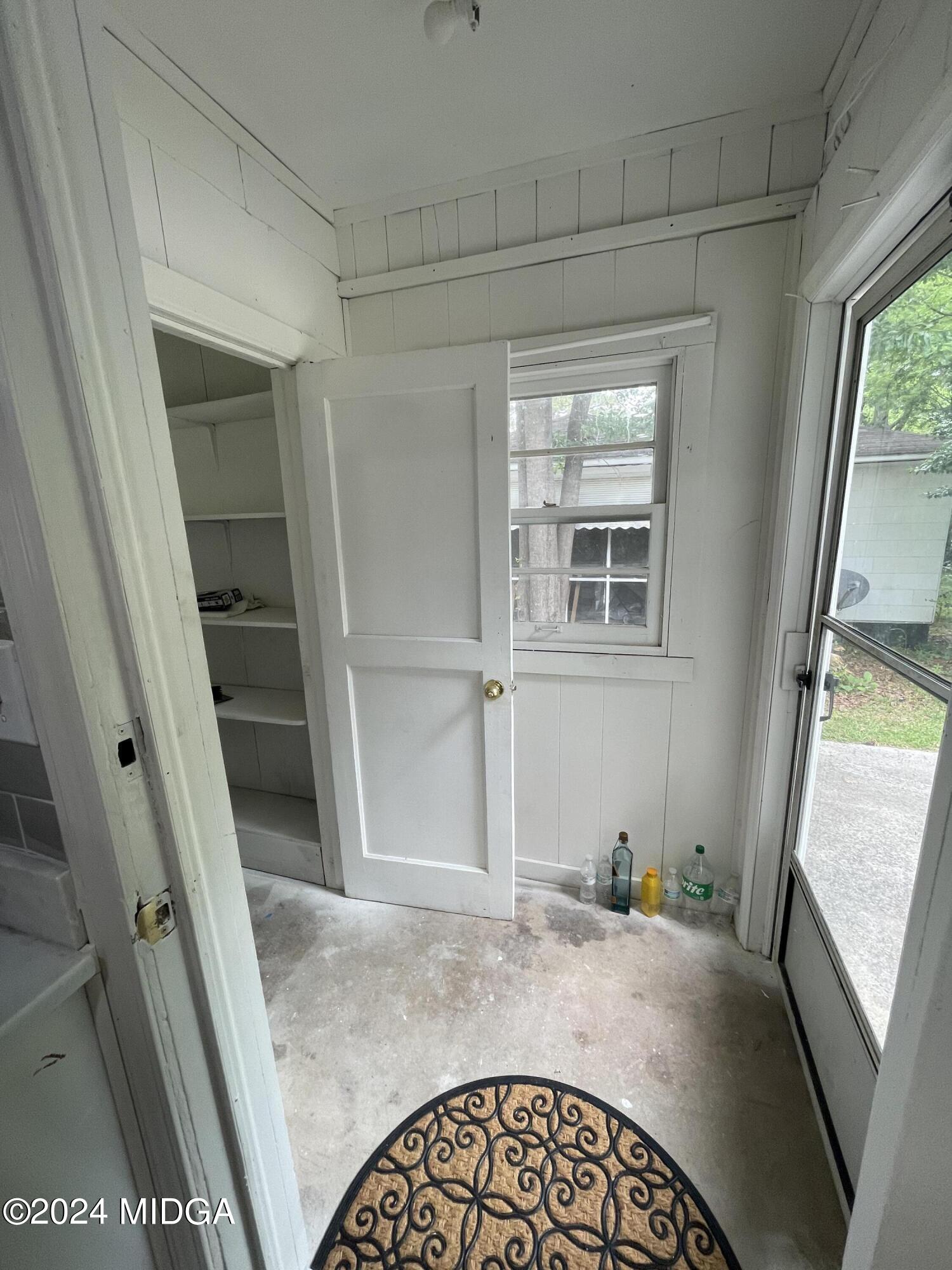 4064 Emory Drive Macon, GA 31206 - Photo 12 of 37 a view of a hallway to a livingroom with furniture