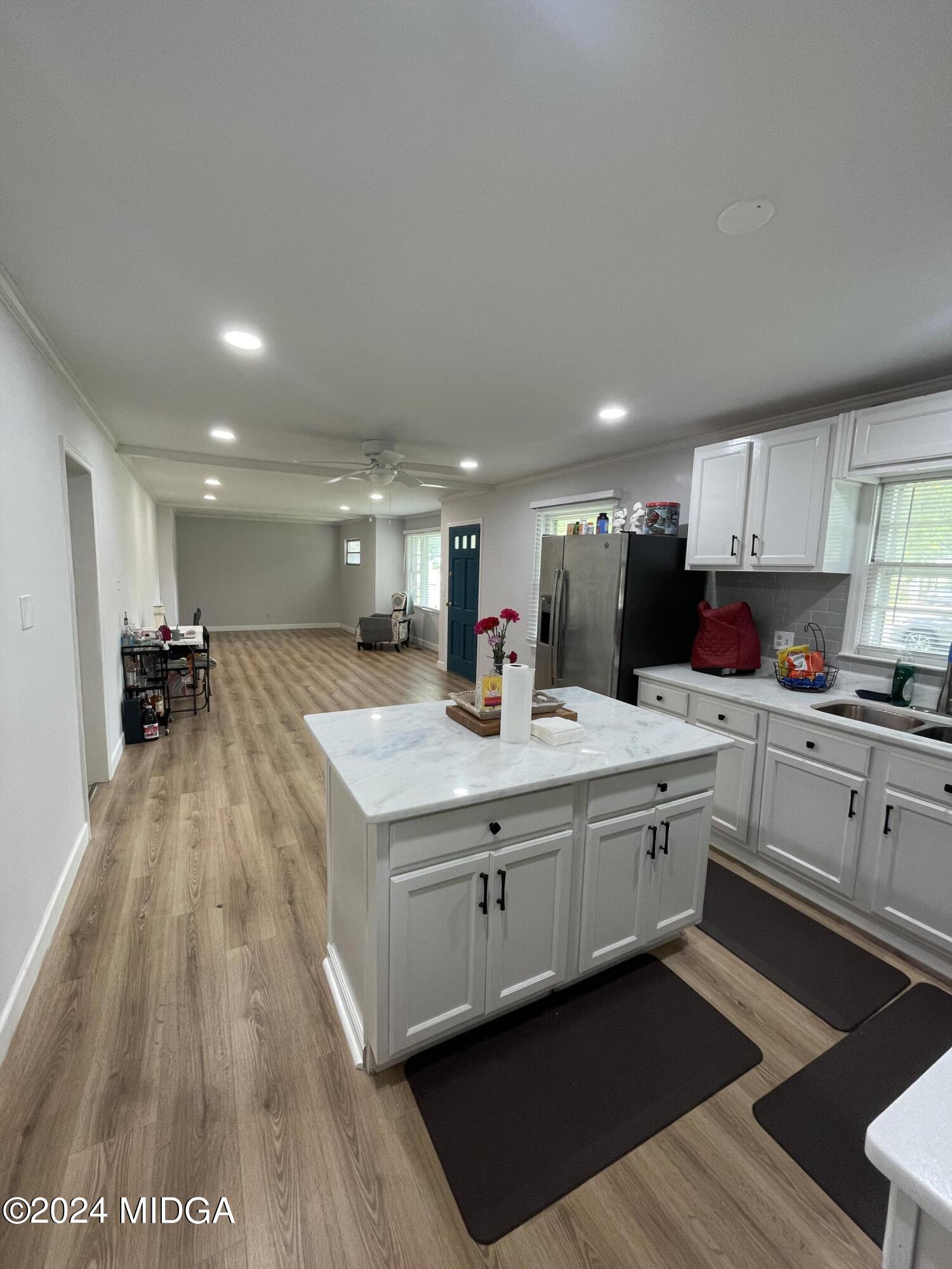 4064 Emory Drive Macon, GA 31206 - Photo 13 of 37 a kitchen with stainless steel appliances granite countertop a sink a stove and a refrigerator