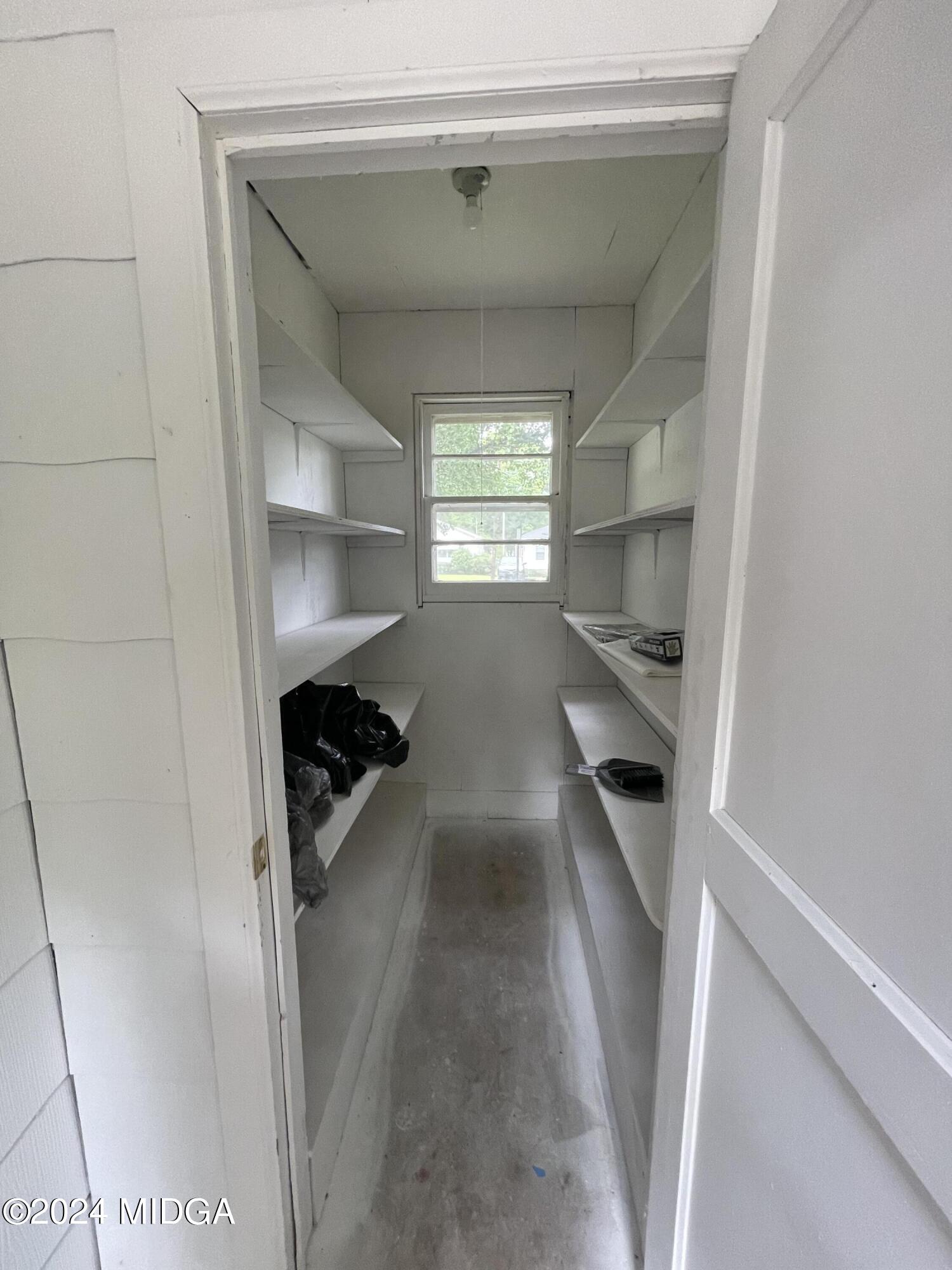 4064 Emory Drive Macon, GA 31206 - Photo 14 of 37 a kitchen with windows and refrigerator