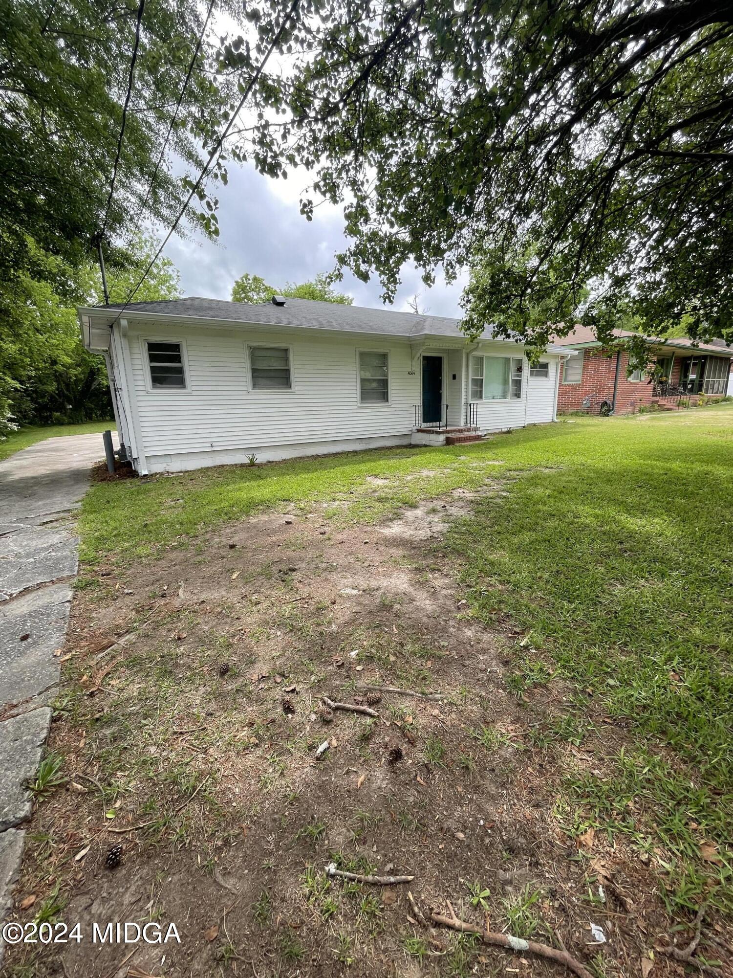 4064 Emory Drive Macon, GA 31206 - Photo 2 of 37 a front view of a house with a garden