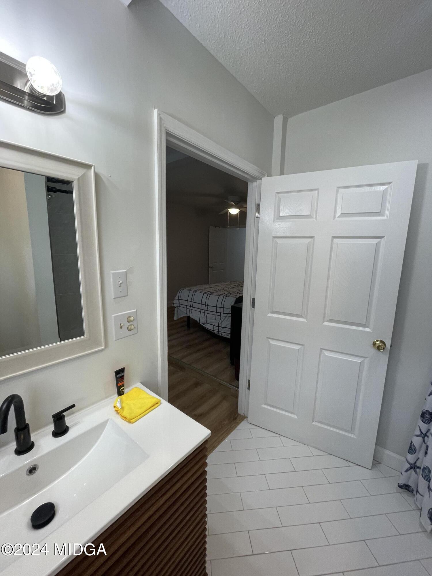 4064 Emory Drive Macon, GA 31206 - Photo 23 of 37 a view of a kitchen from the hallway