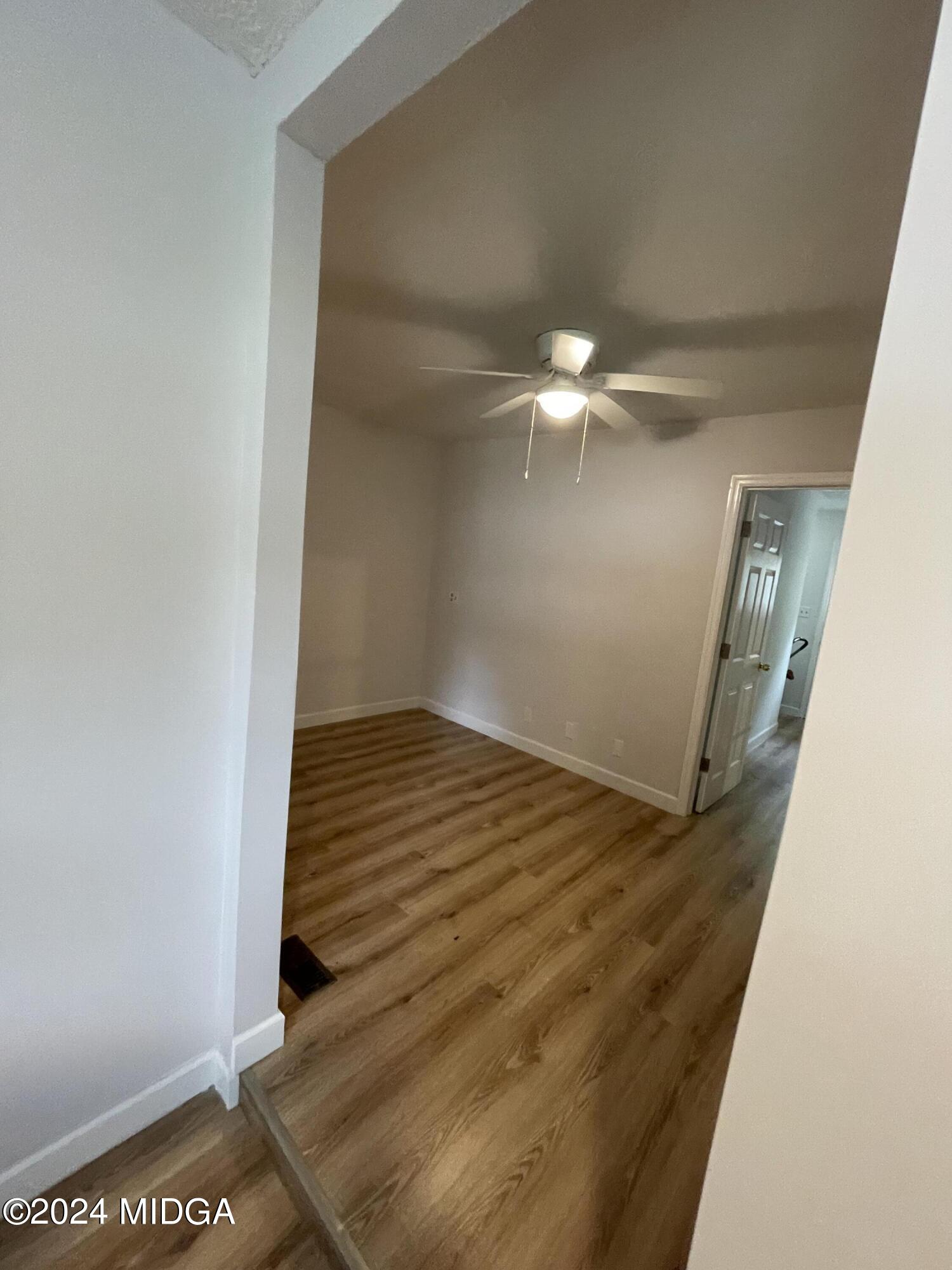 4064 Emory Drive Macon, GA 31206 - Photo 31 of 37 a view of a hallway with wooden floor