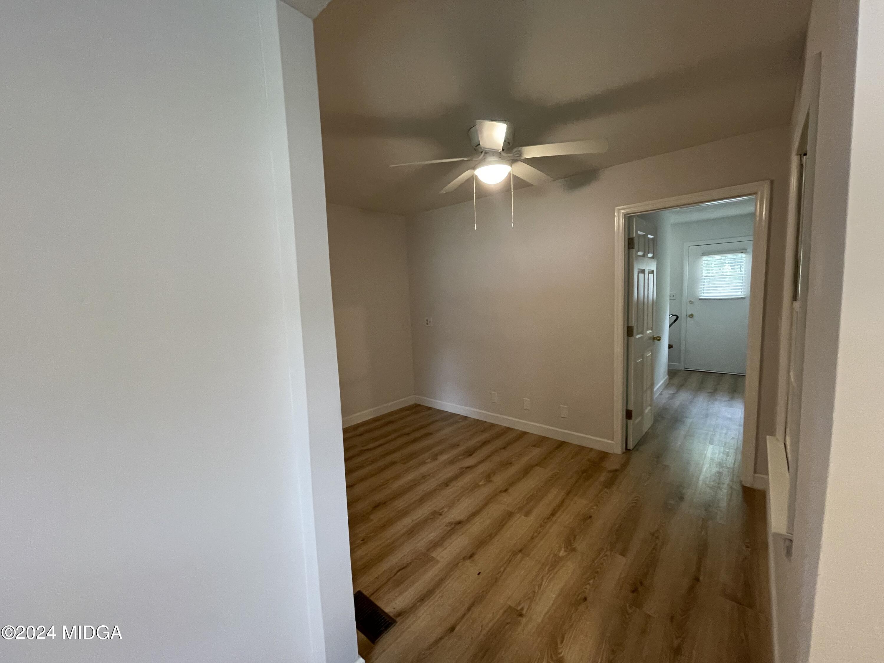 4064 Emory Drive Macon, GA 31206 - Photo 33 of 37 a view of a hallway with wooden floor