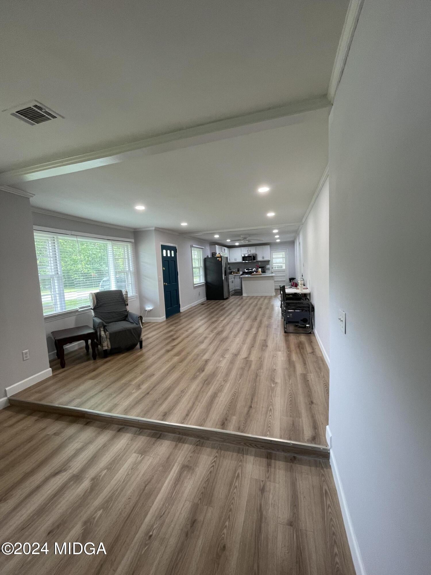 4064 Emory Drive Macon, GA 31206 - Photo 10 of 37 a room with furniture and a wooden floor