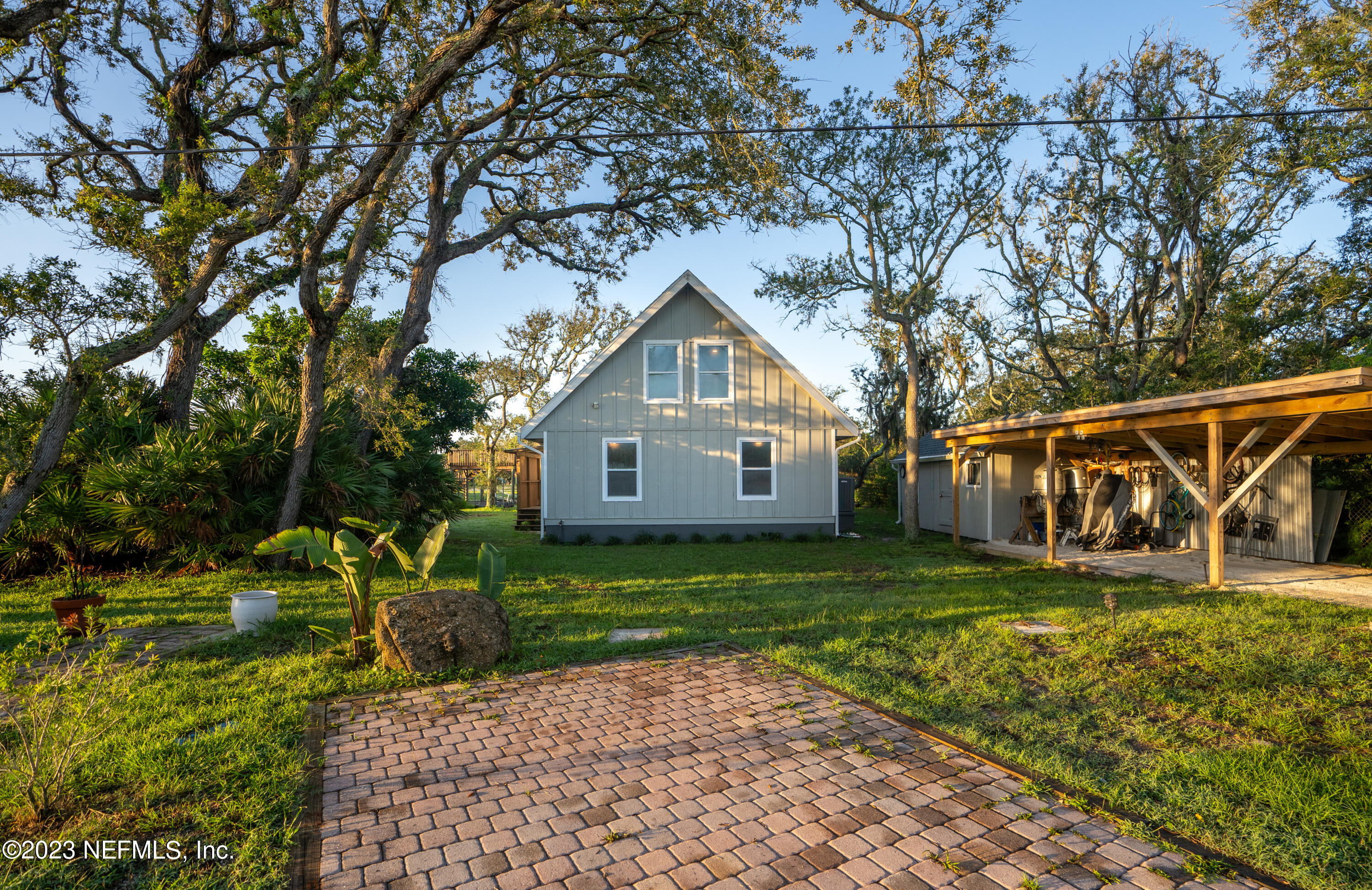 281 Ole Road St. Augustine, FL 32080 - Photo 14 of 61 a front view of a house with garden